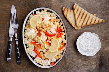 Raw vegetables and chickpeas salad