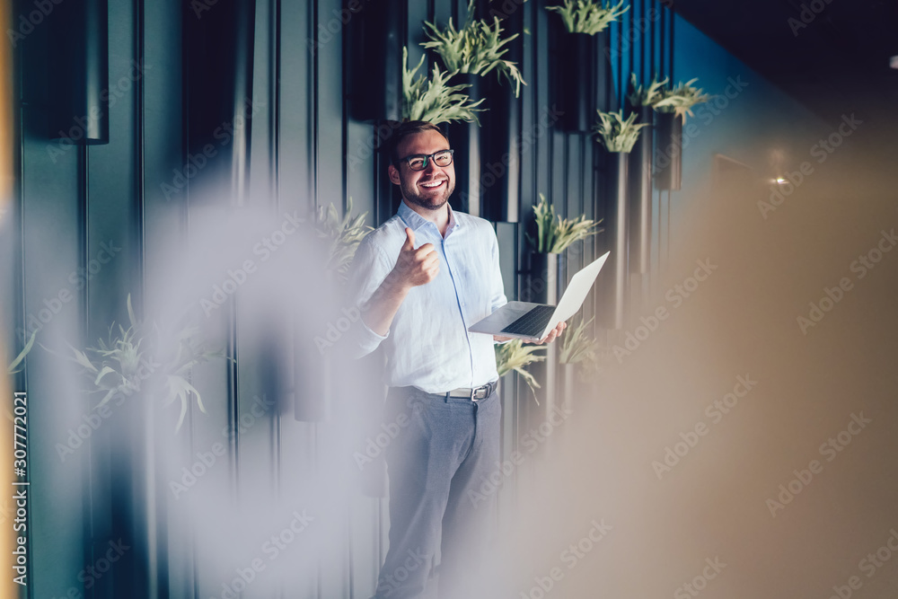 Poster half length portrait of happy analyst using netbook technology with 4g wireless internet connection 