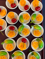 Closeup of Look Choup, unique Thai dessert in white ceramic bowls. Vertical view. 