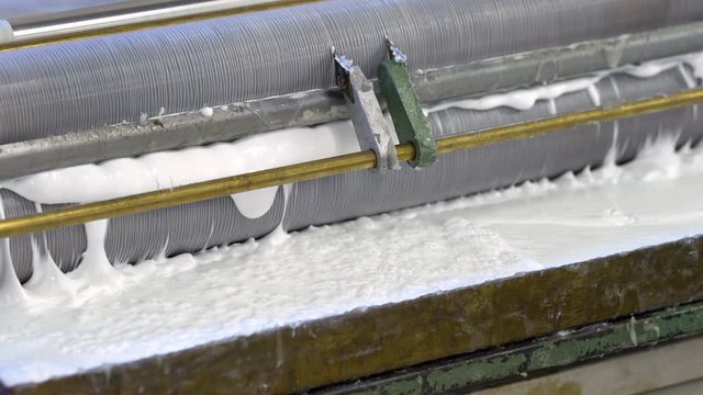 Paper gluing machine in the factory