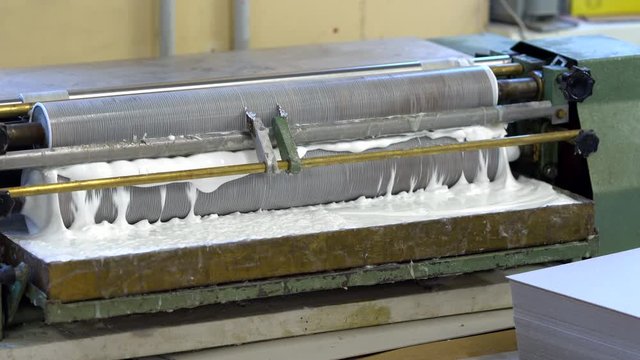 Paper gluing machine in the factory