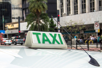 Taxi sign on roof of vehicle in Sao Paulo city