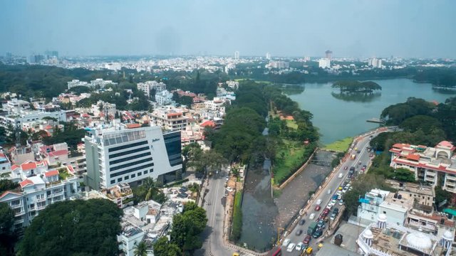 Day to Night Timelapse of Bangalore City Center Area With Large Lake in the Middle