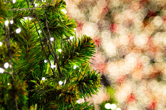 Close up chismas tree with blurred light bokeh flare background