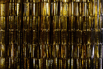Gold Foil strip Curtain hanging on wall