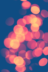 Classic blue background with soft pastel bokeh lights. Holiday, Christmas and New Year background. vertical