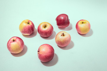 red apples isolated on light blue background