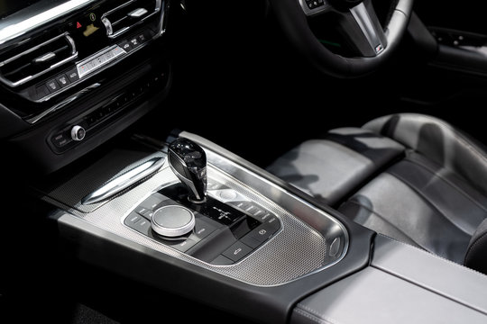 Luxury of car interior at transmission shift gear area. Modern car interior, gearstick radio and air conditioner..