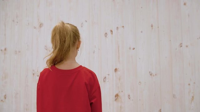 Girl surprising startle friend in light studio background. Two girls laughing fright at unexpected meeting on light wall background