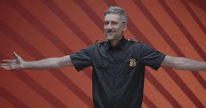 Middle-aged police officer accepting ovation