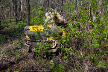 A quad bike in difficult conditions while traveling.