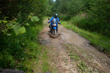 Fototapeta na wymiar Travelling on an enduro motorcycle in the taiga.