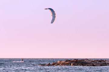 Seascape with kite at sunset as background