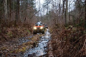 A quad bike in difficult conditions while traveling.