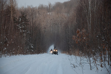 Traveling and outdoor activities in winter on snowmobiles.