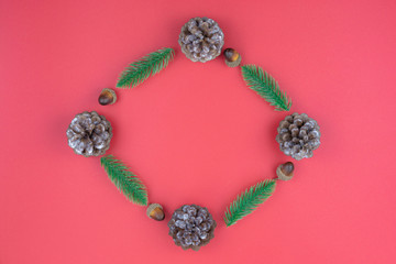 Christmas holidays composition, top view of red Christmas decorations on red background with copy space for text. Flat lay, winter, postcard template, new year concept.