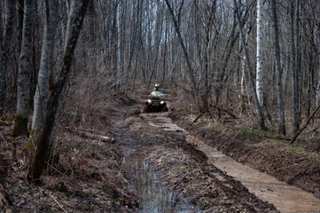 A quad bike in difficult conditions while traveling.