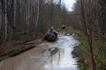 A quad bike in difficult conditions while traveling.