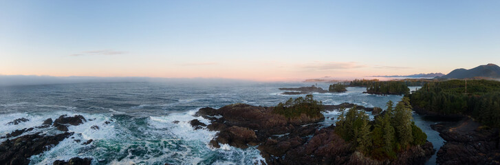 Ucluelet, Vancouver Island, British Columbia, Canada. Aerial Panoramic View of a Small Town near Tofino on a Rocky Pacific Ocean Coast during a cloudy  and colorful morning sunrise.