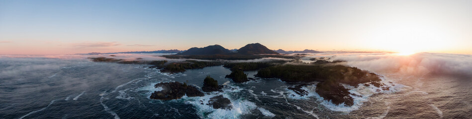 Ucluelet, Vancouver Island, British Columbia, Canada. Aerial Panoramic View of a Small Town near Tofino on a Rocky Pacific Ocean Coast during a cloudy  and colorful morning sunrise.