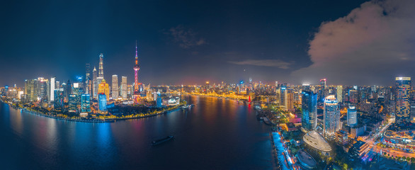 The night view of the city on the huangpu river bank in the center of Shanghai, China - obrazy, fototapety, plakaty