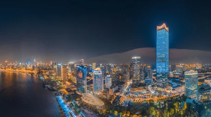 Fotobehang The night view of the city on the huangpu river bank in the center of Shanghai, China © Weiming