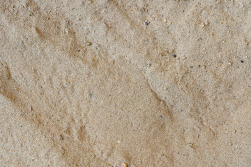 Beach sand texture background closeup