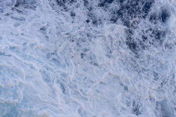 Abstract blue sea water with white foam for background, nature background concept