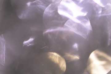 Obraz na płótnie Canvas bright christmas bokeh. iridescent glare silver