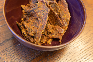 Dried meat called Kilishi in Nigeria. The meat is sliced into thin sheets and dried, salted and spiced.