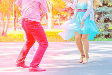 Russia, Samara, August 2017: Beautiful young couple dancing in Gagarin's Park on a summer day.