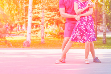 Russia, Samara, August 2017: Beautiful young couple dancing in Gagarin's Park on a summer day.