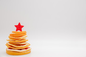 Christmas tree made of dried oranges and lemon. Viewed from above.