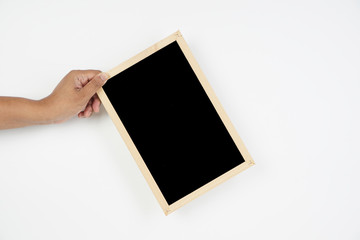 Mens hand holding blackboard over white background. Copy space concept