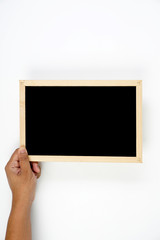 Mens hand holding blackboard over white background. Copy space concept