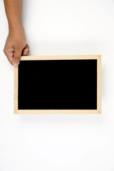 Mens hand holding blackboard over white background. Copy space concept