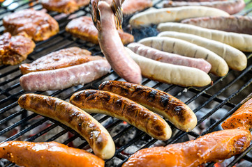 Barbecue grill bbq on coal charcoal grill with steaks bratwurst sausages and meat delicious summer...