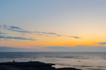 Obraz premium Long Exposure Over Coastal Landscape During Vibrant Colored Twilight On The Island Of Gotland, Sweden