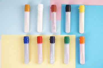 water colour tubes on a colourful paper