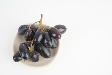 Fresh grape fruits plated over the white background
