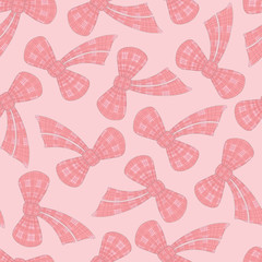 Vector tartan pink bow seamless tossed pattern design.