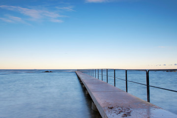 Fototapeta premium Bath pier during sunrise at island of Gotland, Sweden