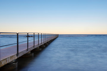 Fototapeta na wymiar Bath pier during sunrise at island of Gotland, Sweden