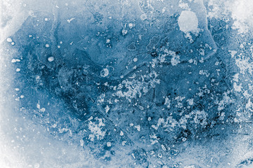 Textured, blue toned, ice block surface with hoar frost, background.