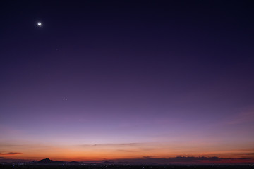 Fototapeta na wymiar Crescent moon with beautiful sunset background . Generous Ramadan stars
