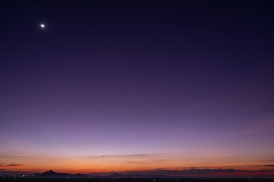 Crescent moon with beautiful sunset background . Generous Ramadan stars