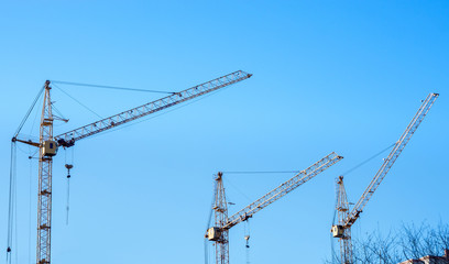 tower Construction site with cranes and building with blue sky background. Construction of the new building.