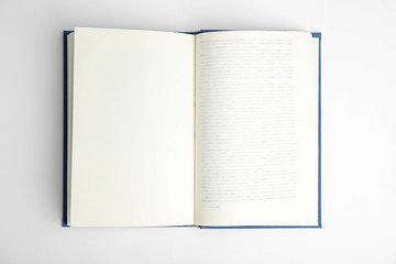 Open book on white background, top view. Space for text