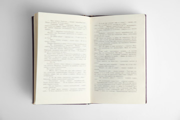 Open book on white background, top view. Space for text