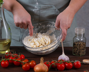the ingredients are mixed in a bowl for the dough
